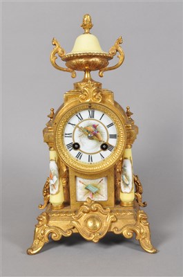 Lot 163 - A 19th century gilt metal and porcelain cased mantle clock