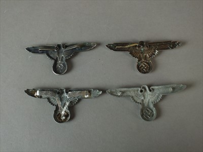 Lot 336 - Reproduction German SS visor cap skulls and eagles