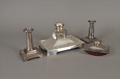 Lot 35 - An early 20th century planished silver plated inkstand and a similar pair of candlesticks
