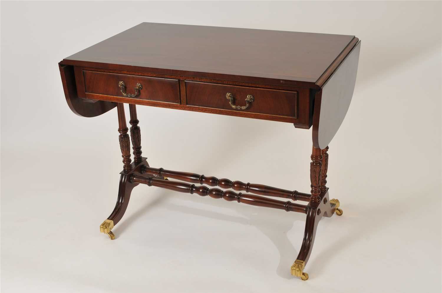Lot 516 - A reproduction Regency style mahogany sofa table