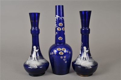 Lot 169 - Pair of blue 'Mary Gregory' vases and one further florally enamelled vase