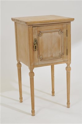 Lot 635 - A limed pale pine bedside cupboard