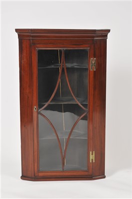 Lot 434 - A 19th century astragal glazed mahogany corner cupboard