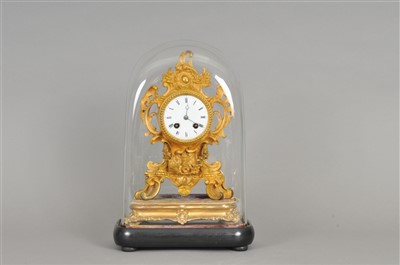 Lot 284 - A French gilt metal mantle clock under glass dome.
