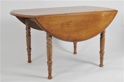 Lot 517 - A pale oak gateleg dining table