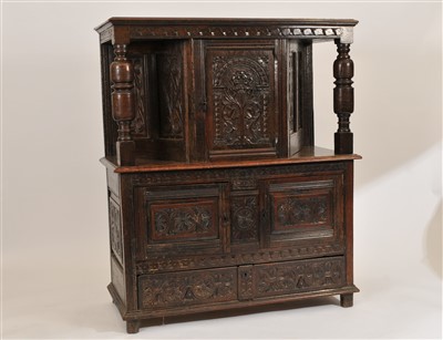 Lot 514 - A 17th century and later carved oak court cupboard