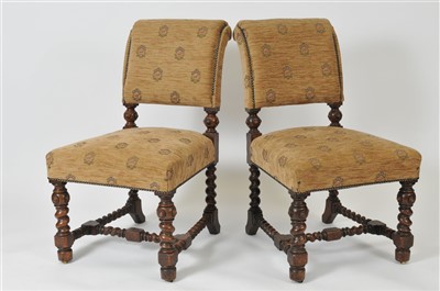 Lot 490 - A set of twelve upholstered early 20th century oak dining chairs