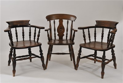 Lot 426 - A pair of late 19th century elm seated smoker's bow chairs and two others