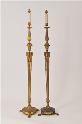 Lot 397 - A pair of late 19th century converted floor standing gilded brass standard lamps