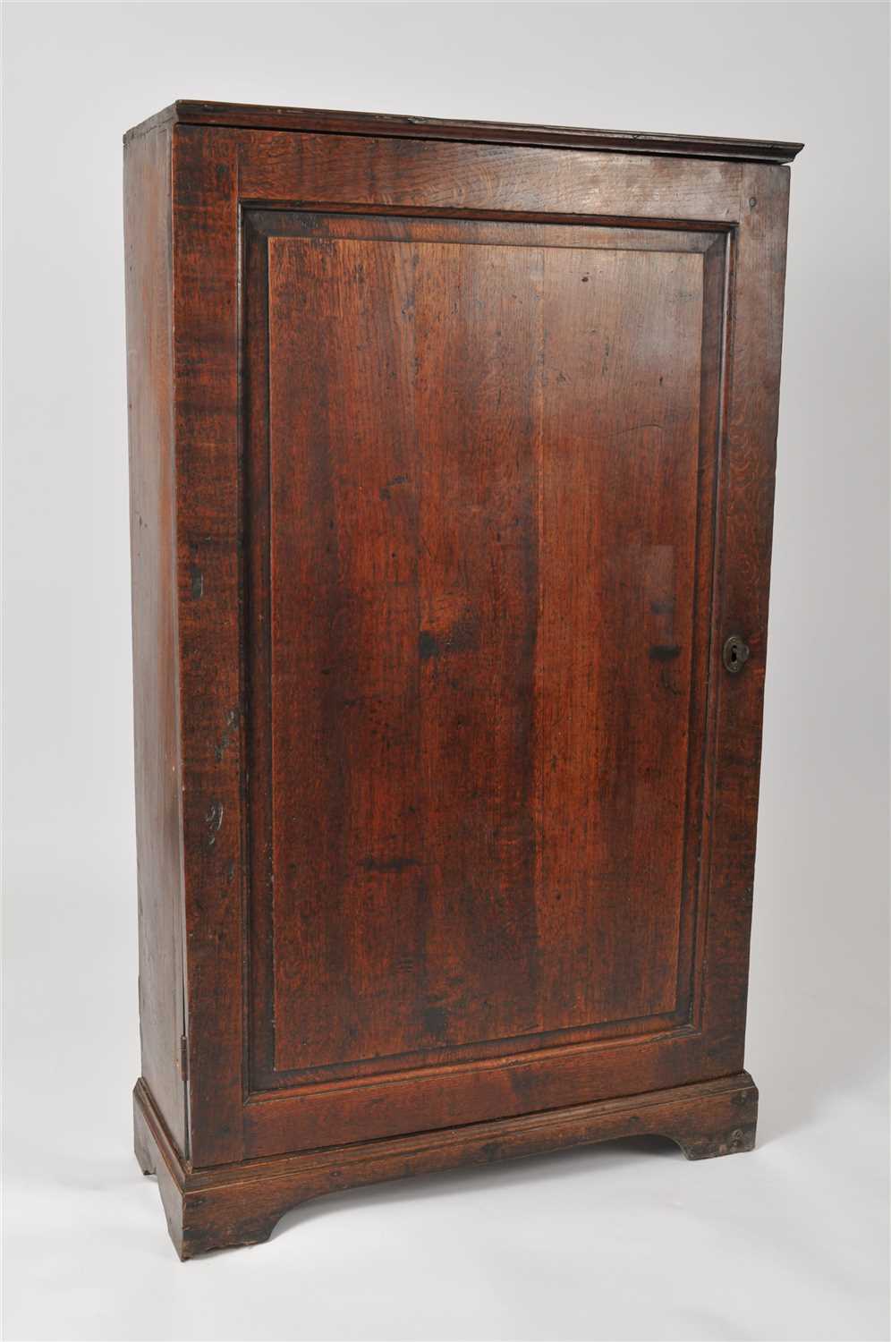 Lot 452 - A rustic 18th century and later country oak hall cupboard