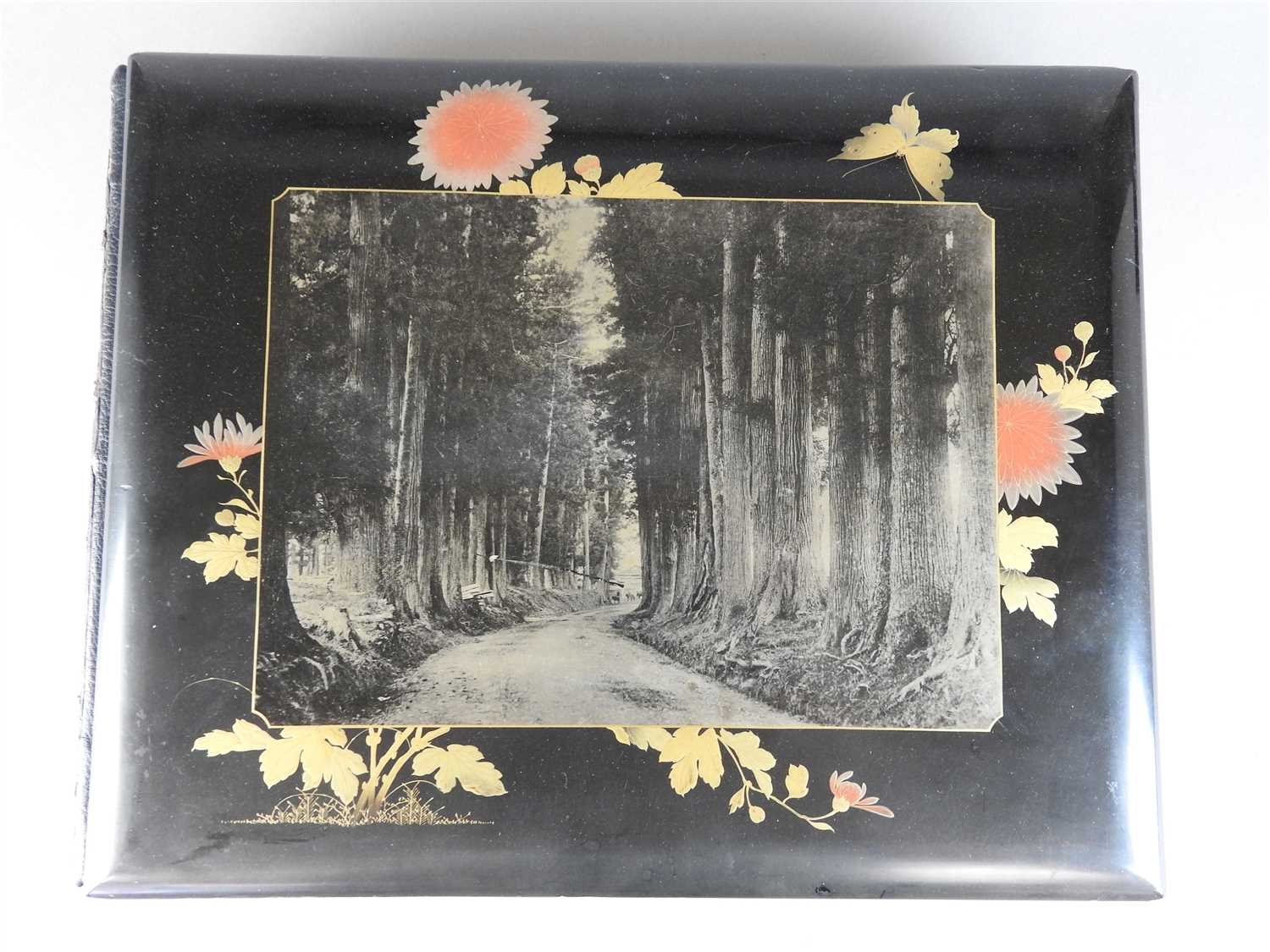 Lot 101 - A Japanese lacquer bound photograph album of...