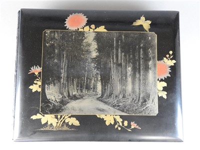 Lot 101 - A Japanese lacquer bound photograph album of...