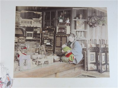 Lot 101 - A Japanese lacquer bound photograph album of...