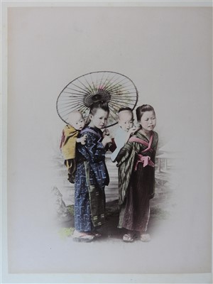 Lot 101 - A Japanese lacquer bound photograph album of...