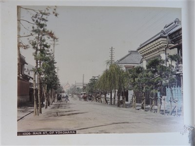 Lot 101 - A Japanese lacquer bound photograph album of...