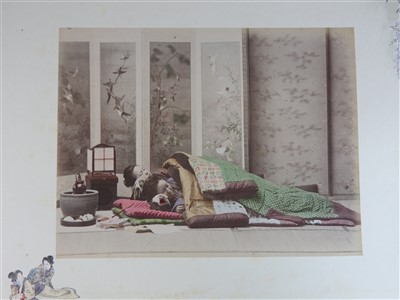 Lot 101 - A Japanese lacquer bound photograph album of...