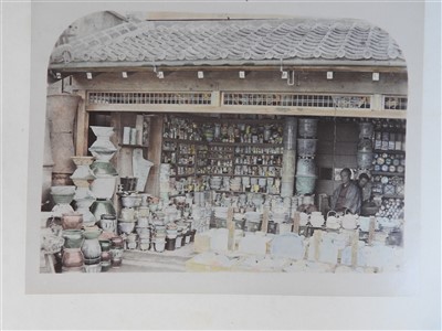 Lot 101 - A Japanese lacquer bound photograph album of...