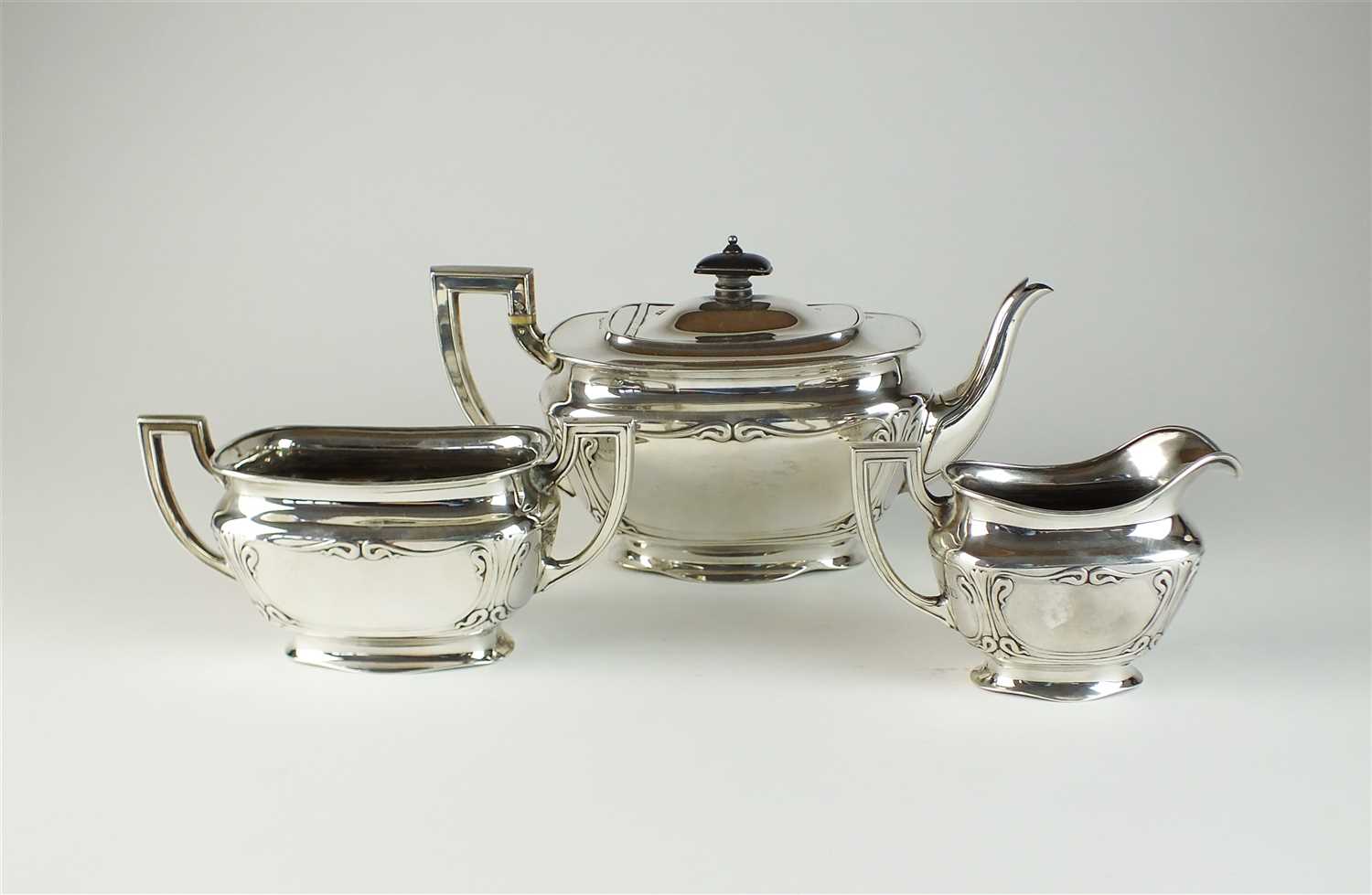 Lot 12 - An Art Nouveau three piece silver tea service