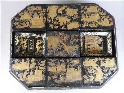 Lot 118 - A Chinese export lacquer games box and cover,...