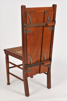 Lot 786 - An Edwardian pale oak tailor's shop advertising chair