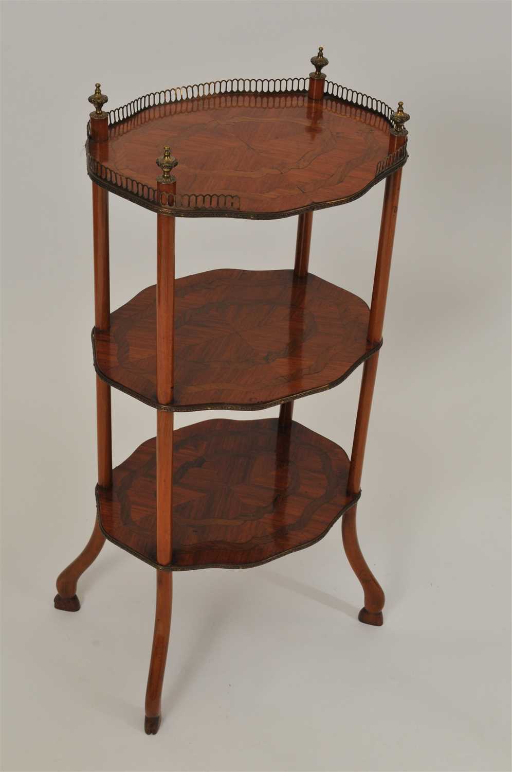 Lot 495 - An early 20th century French three tier Kingwood etagere