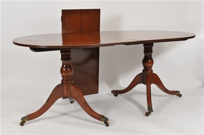 Lot 339 - A twin pillar mahogany pedestal dining table