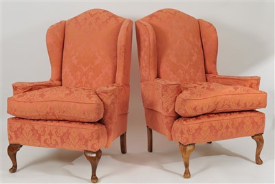 Lot 451 - A pair of Georgian style upholstered wing armchairs