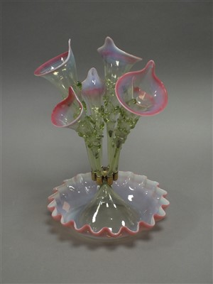 Lot 209 - A late Victorian cranberry and uranium glass epergne