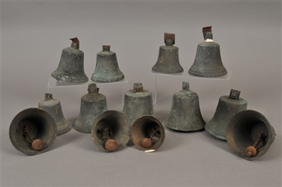 Lot 321 - A collection of 23 graduating weathered bronze hand bells