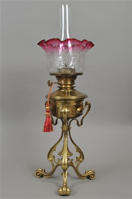 Lot 395 - A late 19th century brass oil lamp stand in the manner of W.A.S Benson