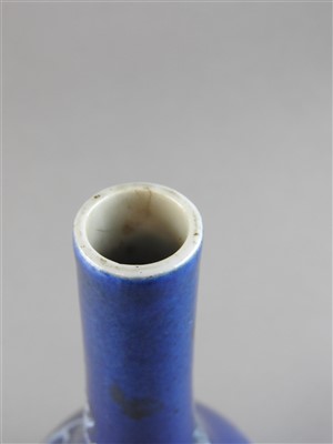 Lot 7 - A Chinese powder blue ground slip decorated...