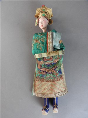 Lot 51 - A Chinese painted wood doll, late Qing Dynasty,...