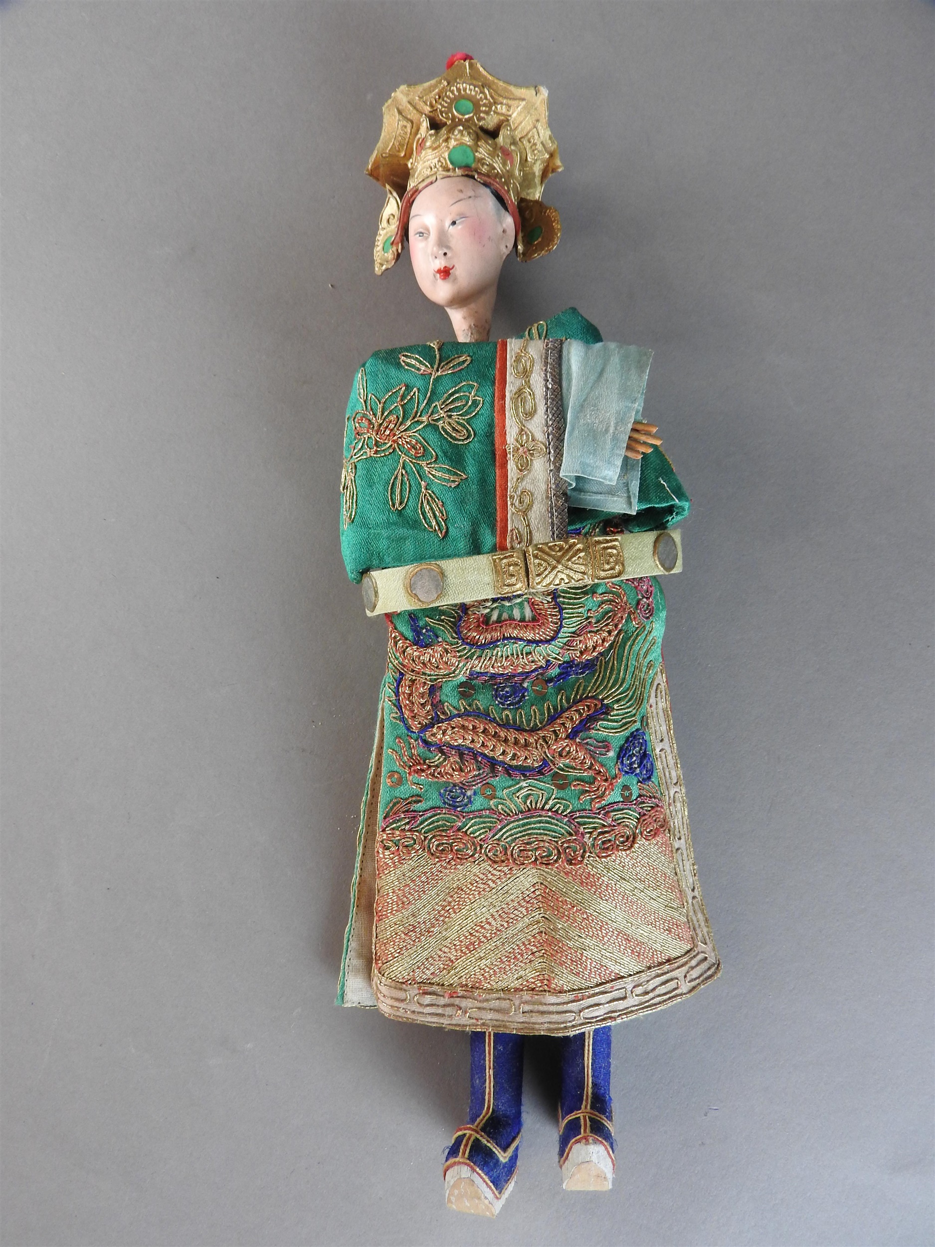 Lot 51 - A Chinese painted wood doll, late Qing