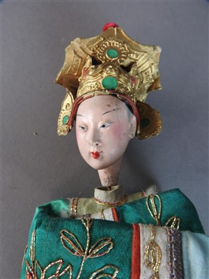 Lot 51 - A Chinese painted wood doll, late Qing Dynasty,...