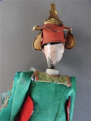 Lot 51 - A Chinese painted wood doll, late Qing Dynasty,...