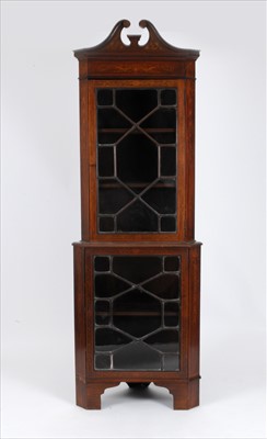 Lot 327 - An Edwardian mahogany two sectional corner cupboard
