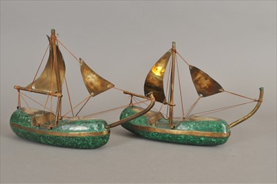 Lot 342 - A pair of African folk art models of boats made from malachite and brass