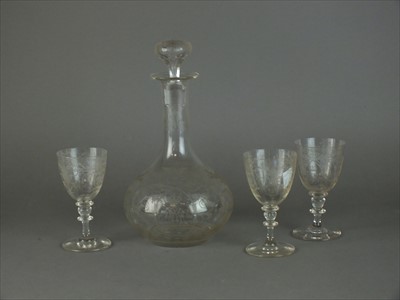 Lot 6 - Engraved decanter and three matching glasses
