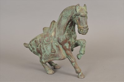Lot 721 - A Chinese Tang style bronze model of a horse