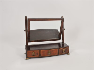 Lot 313 - A bow fronted 19th century mahogany veneered dressing mirror