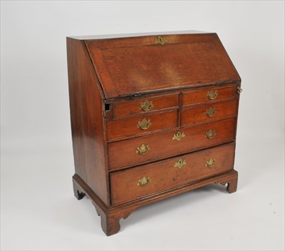 Lot 312 - A rustic 19th century oak bureau
