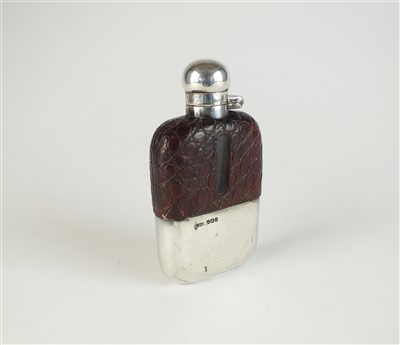 Lot 50 - A small silver mounted hip flask