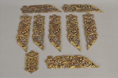 Lot 465 - A set of eight late 19th / early 20th century pierced cast brass furniture / door mounts