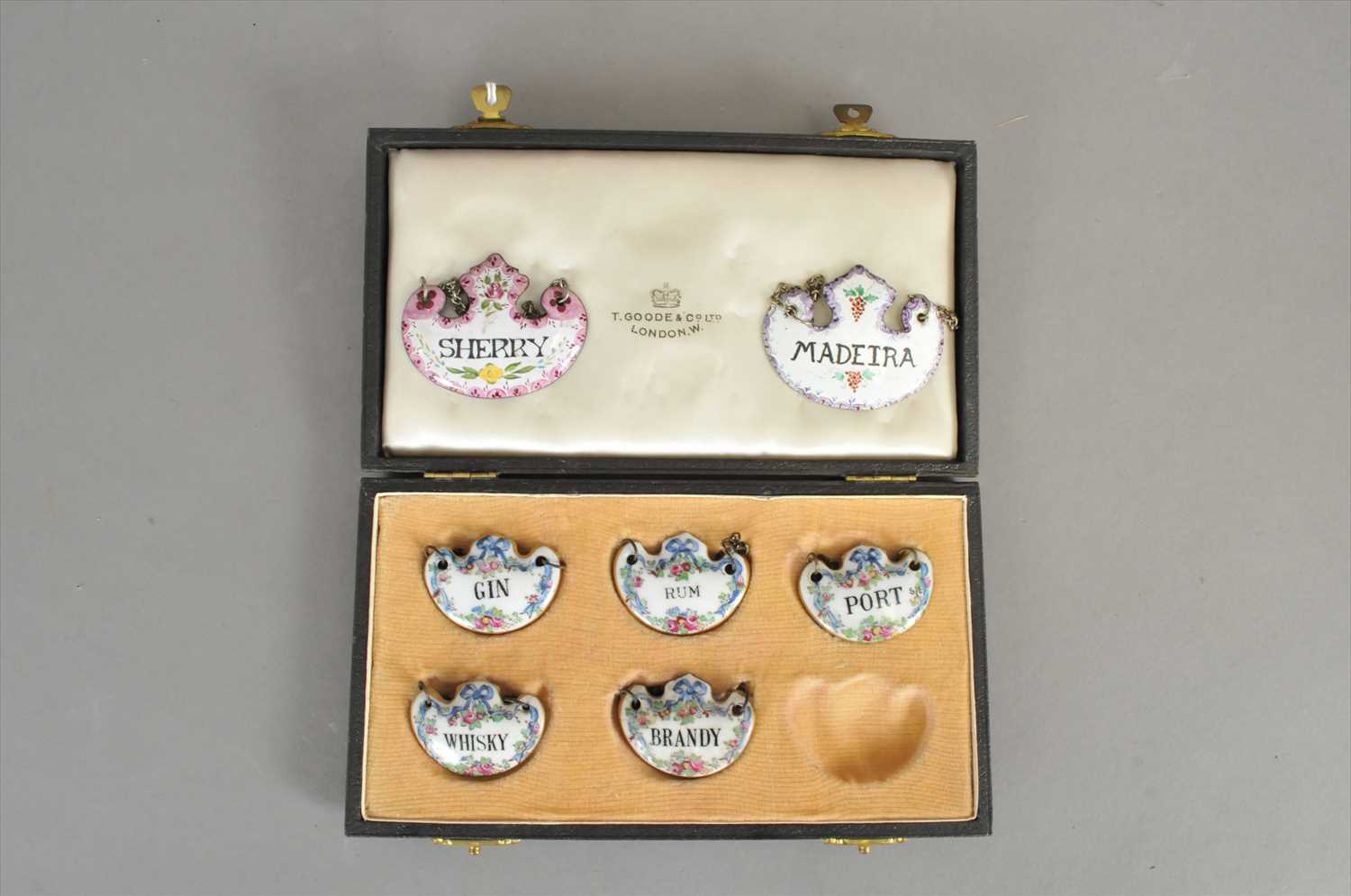 Lot 496 - A cased set of Crown Staffordshire porcelain decanter labels and two enamelled examples