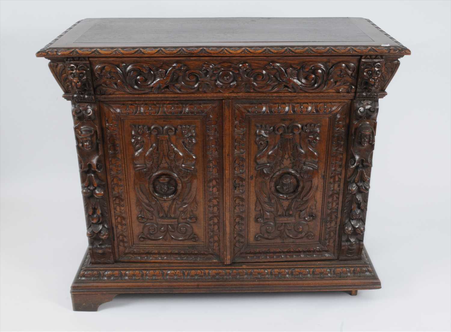 Lot 749 - A late 19th century continental carved oak hall cupboard in the Flemish style