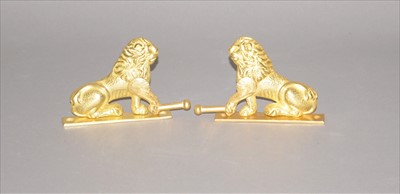 Lot 487 - A decorative pair of cast brass wall-mounting bell pulls
