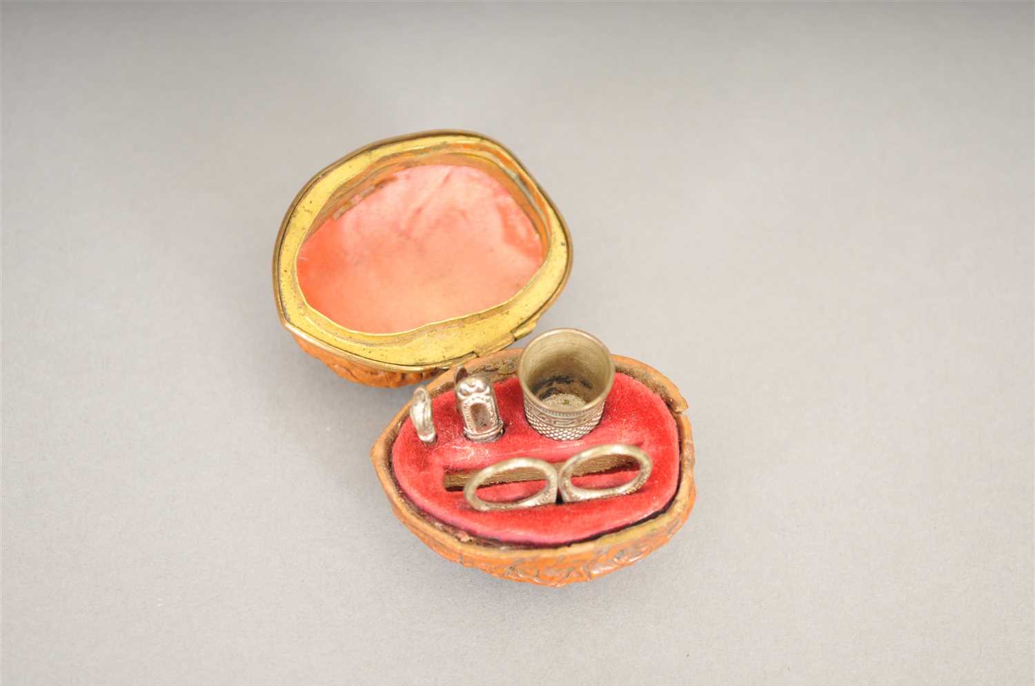 Lot 485 - A mid 19th century miniature sewing etui cased in a walnut
