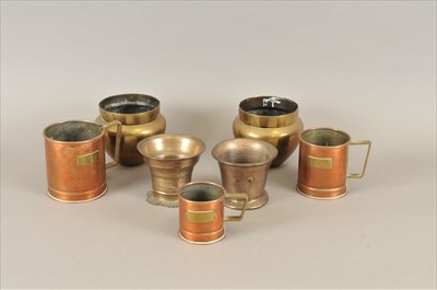 Lot 471 - Two early bronze mortars, a graduating trio of copper grain measures and a pair of brass vases