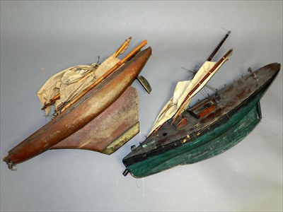 Lot 517 - Two early 20th century painted scratch-built pond launch models of sail boats