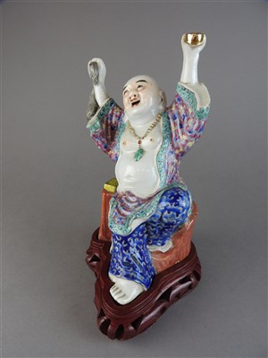 Lot 8 - A Chinese famille rose porcelain figure of Hotei